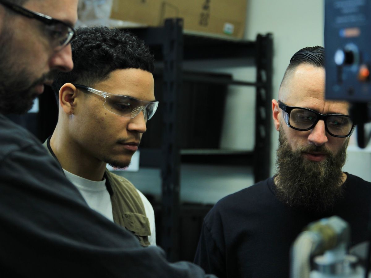 Titan Works technicians working at the casting station